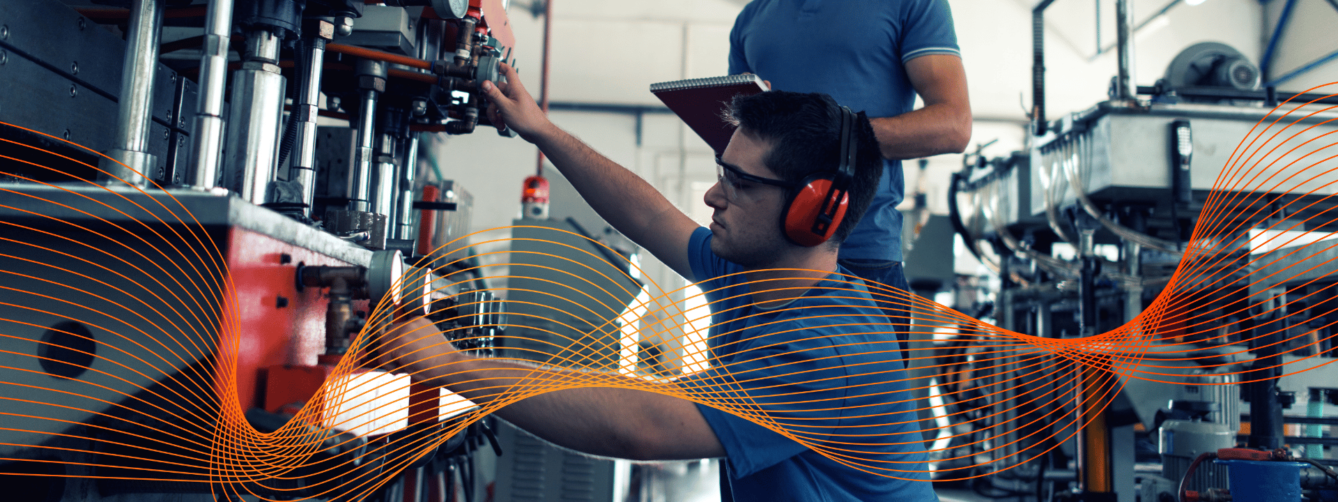 Technician adjusting machinery in an industrial production environment for formulation and processing operations